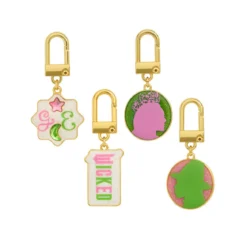 Wicked - Pink Goes Good With Green Koffer mit Charm Armband